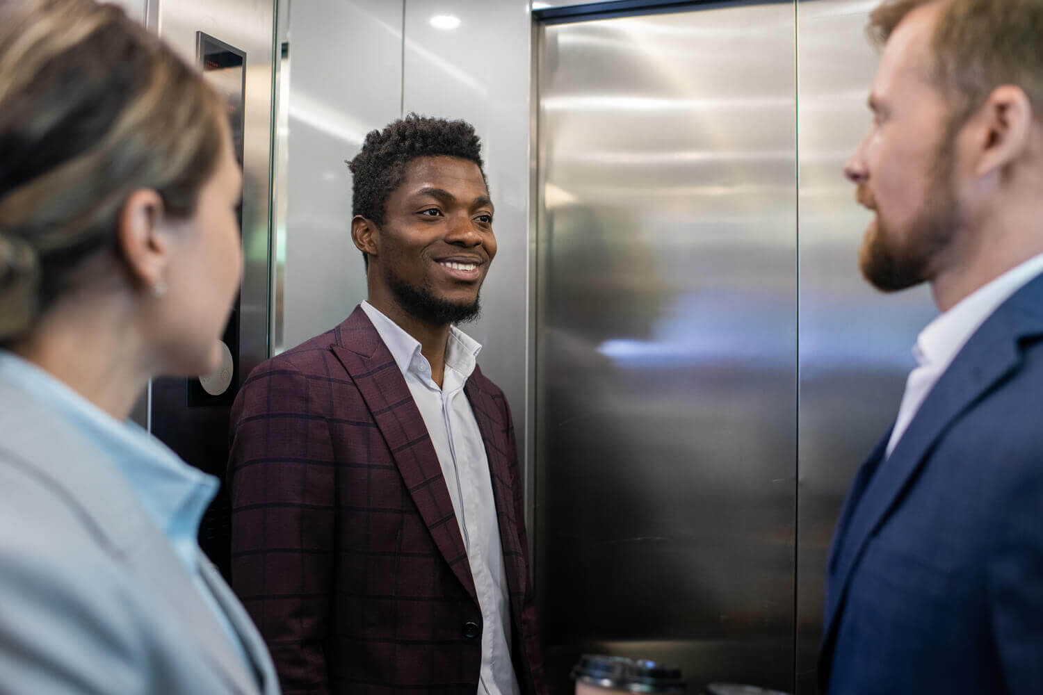 Business people on elevator